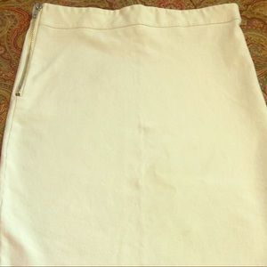 White form fitting white mid length skirt
